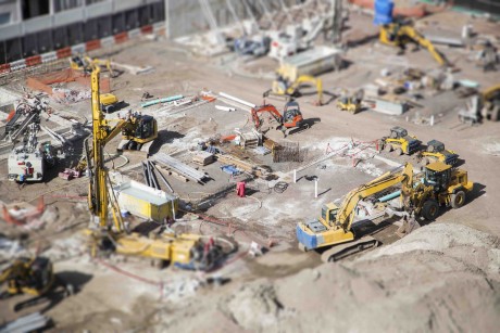 Aerial View of Busy Construction Site with Extreme Bokeh.